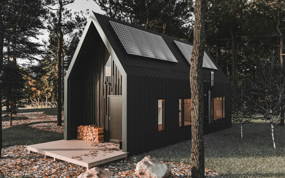 Modern black tiny house with solar panels in a forest